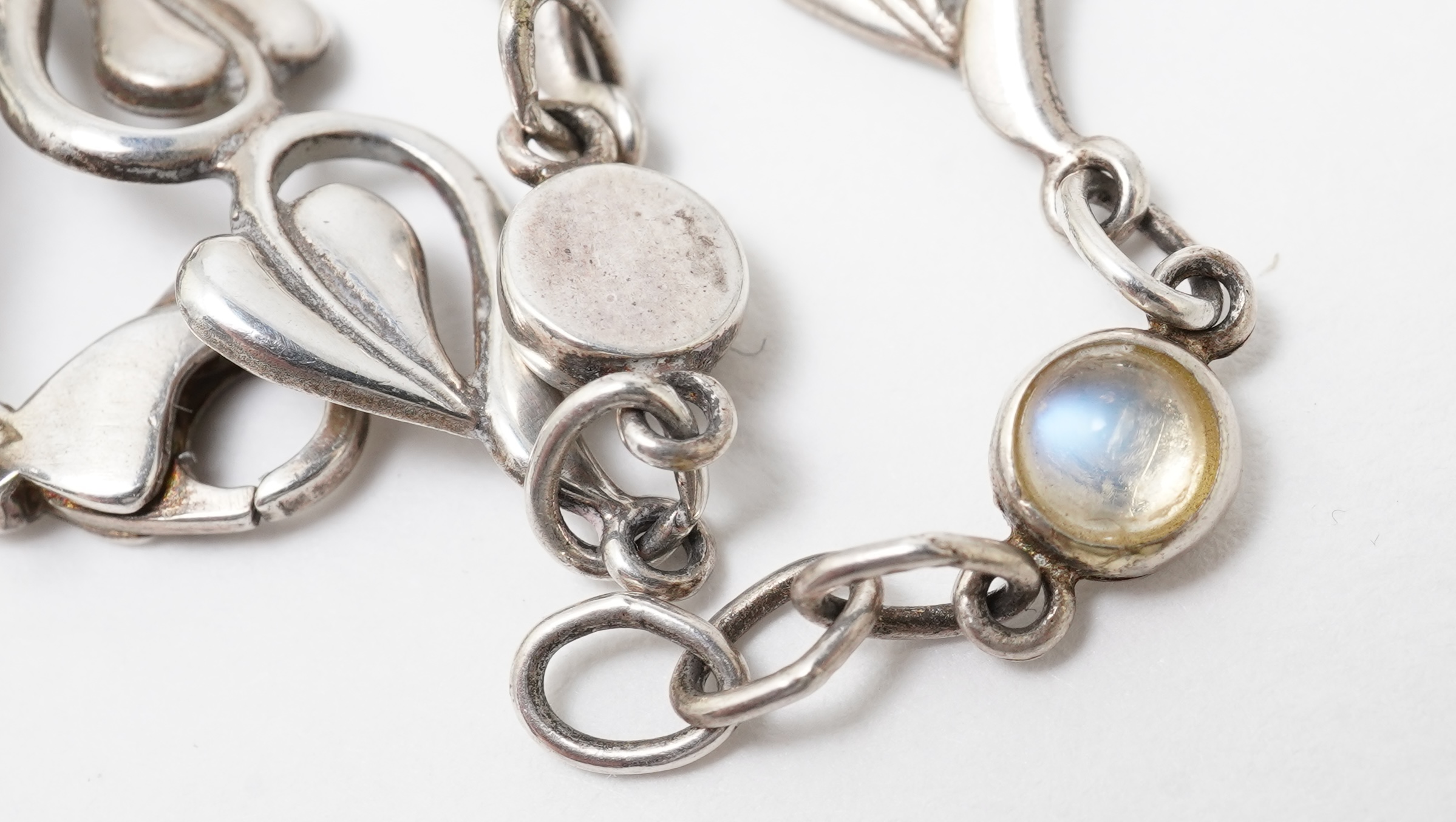 A collection of jewels and accessories including a moonstone bracelet